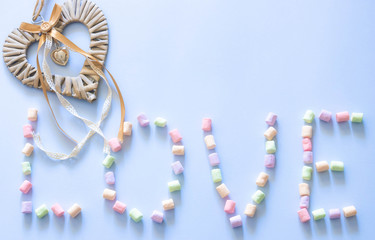 Happy Valentine's Day love symbol sign. Minimal flat design. Sweet food. blue background. top view.copy space