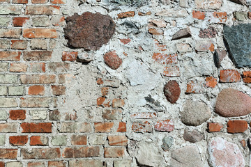 wall of red brick and stone