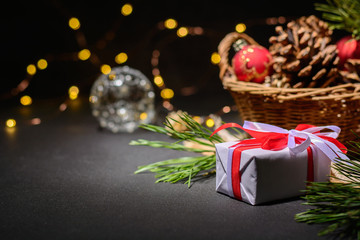 Dark magic background card for Christmas or New Year. Bright blurry lights of a garland. Place for greeting text.