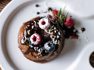 Chocolate cream mousse cake with fresh berries. delicious dessert.