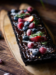 Rectangular Tart Chocolate cheesecake with fresh berries. delicious dessert for celebrate.