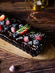 Rectangular Tart Chocolate cheesecake with fresh berries. delicious dessert for celebrate.