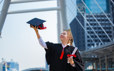 Happy woman on her graduation day University. Education and people.