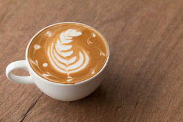 Latte art in a cup topping beautiful art from milk