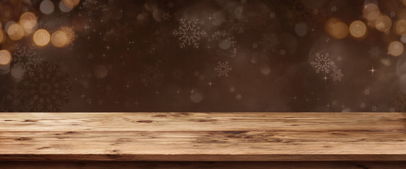Wooden table with christmas background - obrazy, fototapety, plakaty
