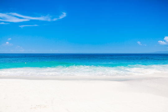 Tropical white beach with blue ocean in tropical island