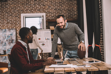 casual businesspeople working together on project in loft office