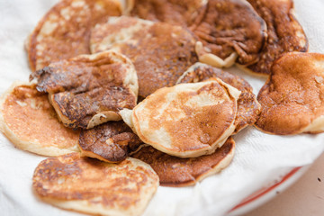 Ready pancakes on a plate. Rosy fresh and tasty pastries. Ready breakfast on a plate.