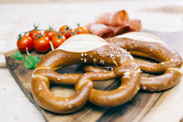 Pretzel concept on bright wooden table