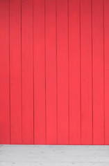 red wooden plank wall and white wooden floor