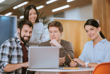 Obraz premium Attractive four colleagues launching startup