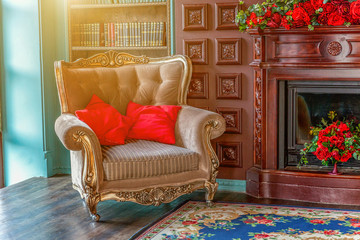 Luxury classic interior of home library. Sitting room with bookshelf, books, arm chair, sofa and fireplace. Clean and modern decoration with elegant furniture. Education read study wisdom concept