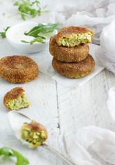 Fried vegetarian broccoli and quinoa burgers