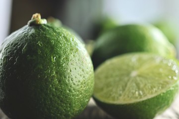 limes slices on wooden table. Detox diet, fresh lime Background, Close up shot, fruit macro photography