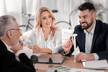 Happy businesspeople sitting at the table