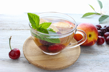 Menu diet plan or program, a glass of cocktail berries, tape measure, dumbbells and diet food fresh fruits . Weight loss and the concept of detoxification