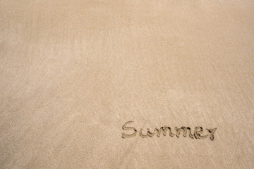 Fototapeta na wymiar Summer Text message in sand on the beach