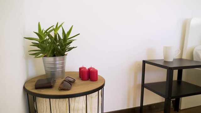 Authentic room with undone bed and every day itens on the table.