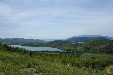 Fototapeta na wymiar Landscape with Lake and Mountains