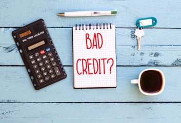 Writing note showing Bad Credit Question on notebook 