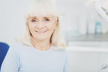 Fototapeta premium Gay senior woman grinning to camera