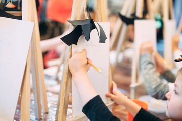 group lesson in drawing. Children learn to draw in the classroom.