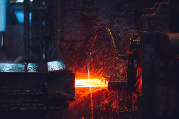 hot steel on conveyor in steel mill
