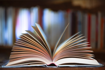 Open book with library background in the library