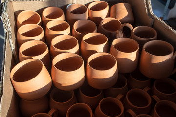 Close-up shoot of handmade pots made in pottery workshop