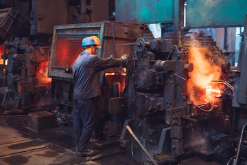 Workers in the steel mill.
