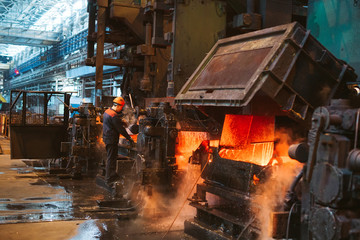 Workers in the steel mill.