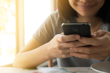 Woman's Hands using a smart-phone, Shopping online concept