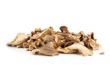 Lot of slices of dry brown mushroom boletus edulis variety heap isolated on white background