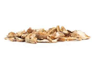 Lot of slices of dry brown mushroom boletus edulis variety stack isolated on white background