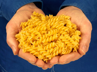 MAN HOLDING FUSILLI PASTA