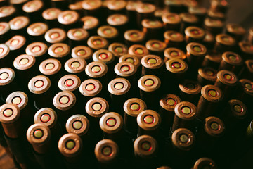 Bullets on wooden background.