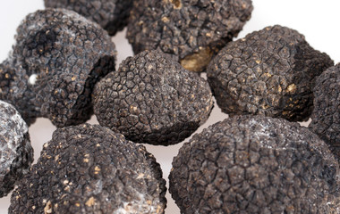 Black truffles isolated on a white background.