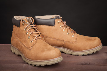 Men's brown leather boots. Stylish winter shoes