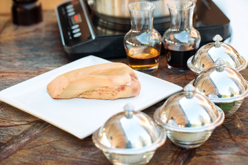 Goose liver on a wooden Board in the restaurant before cooking.