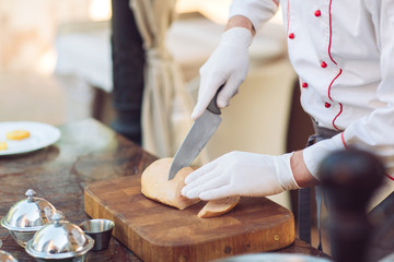 Goose liver on a wooden Board in the restaurant before cooking. © davit85