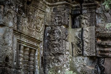 Obraz premium Ta Prohm Angkor Wat Cambodia. The ancient temple of Ta Prohm at Angkor Wat, Cambodia where roots of the jungle trees intertwine with the masonry of these ancient structures producing surreal world.
