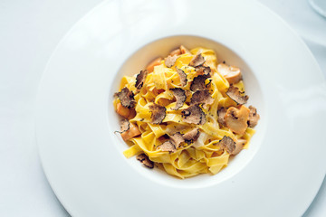 Pasta with truffles, typical autumn dish.Restaurant menu dish.