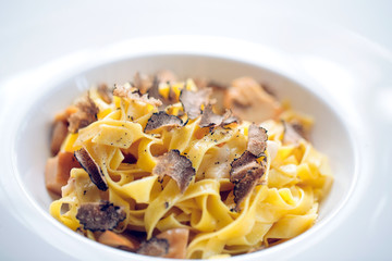 Pasta with truffles, typical autumn dish.Restaurant menu dish.