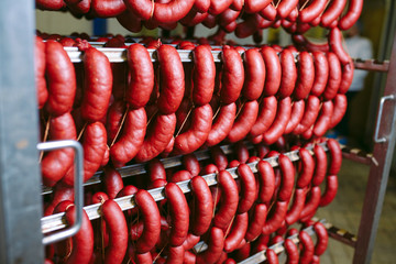 Smoked sausage in the oven. Sausage production in the factory.