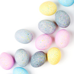 Background with pale pink, blue, yellow and gray Easter eggs. Compositions in pastel colors.  Easter concept