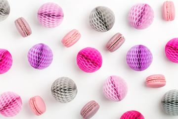 Stylish background with macaroons and lilac honeycomb balls with copy space for text. isolated on white background.