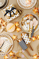 Accessories for children's parties in Gold  color. Flat lay, top view