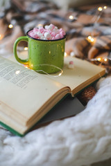 Christmas composition. garland book and marshmallow mug. Flat la