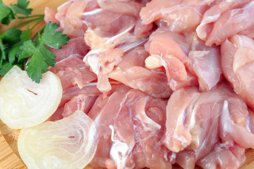 raw chicken goulash on white background