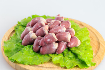 raw chicken hearts on white background